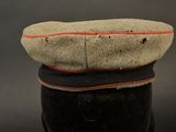 a close up of a hat with a red line on it