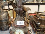 a lot of antique clocks on display in a glass case