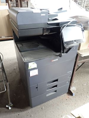 a printer that is sitting on top of a stack of boxes