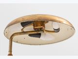 an image of a gold and black lamp with a white background