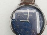 a close up of a wrist watch with a blue face