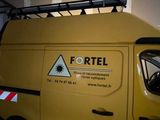 a yellow van that is parked in a garage
