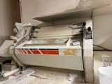 a machine that is sitting in the corner of a room