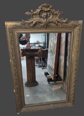 a mirror that is sitting on the floor in front of a table