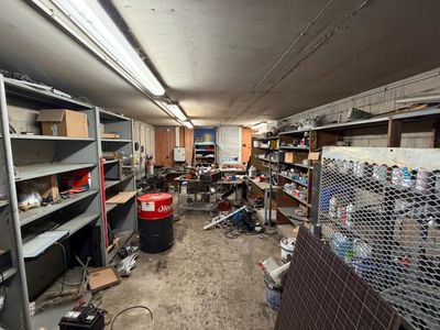 a room filled with lots of clutter and lots of shelves