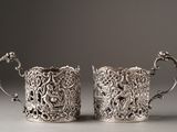 pair of antique silverplated cups with floral designs