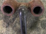 two pipes that are connected to each other on the floor