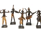 six bronze figurines of a group of people with horns and spears