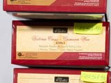 three boxes of tea sitting on top of a table next to each other