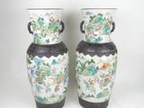 two vases that are sitting on a white surface