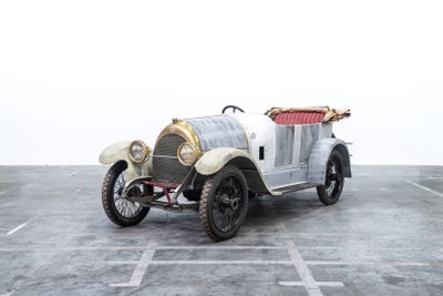 an image of a vintage car parked in a parking lot