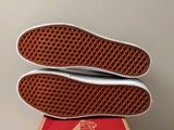 a pair of shoes that are on top of a box