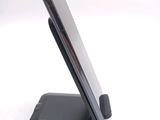 a cell phone that is sitting on top of a stand