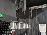 two lamps hanging from the ceiling in a room