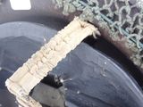 a close up of a piece of fabric on a toilet