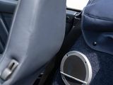 a car with a speaker in the back seat of it