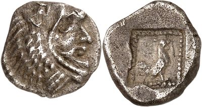 a silver coin with an image of a woman on it