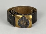 a belt with a brass buckle and a black leather belt