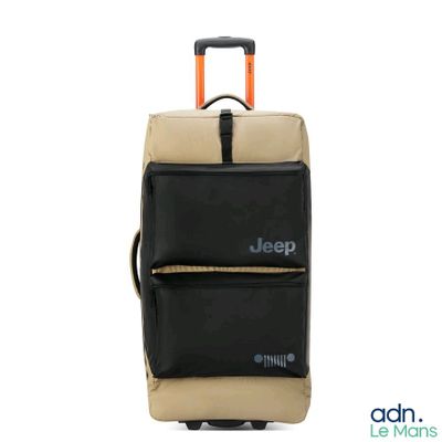 une valise noire et beige ornée d'un logo représentant une jeep