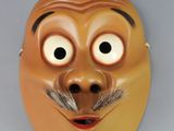 a brown mask with a mustache and a moustache on it