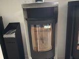 two wood burning stoves in the corner of a room
