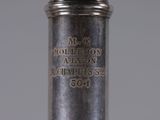 an antique silver plated wine bottle with the name of a person on it