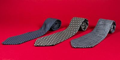 three ties on a red background with a red background