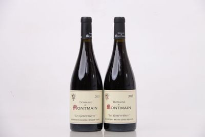 deux bouteilles de vin posées sur une table l'une à côté de l'autre