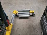 a picture of a forklift with two cylinders attached to it
