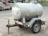 a trailer with a tank attached to the back of it