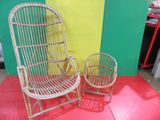 pair of wicker chairs in a room with a yellow and green wall