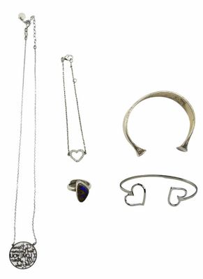 an assortment of jewelry including a necklace, bracelet, and ring