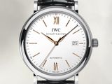 a close up of a wrist watch with a white dial and black leather strap