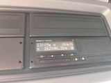 a close up of a radio in a car ' s dashboard