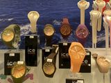 many watches on display on a table in a store