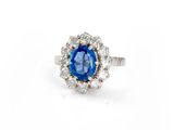 a blue sapphire and diamond cluster ring