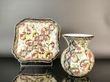 two vases that are sitting on a table