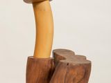 wooden sculpture of a mushroom and a log on a white surface