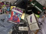 a pile of various items that are on a bed