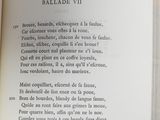 an open book with a poem in it on a table