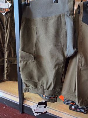 a display of men ' s clothing in a store window
