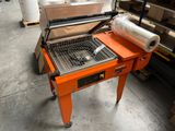 a machine that is sitting on a table in a warehouse