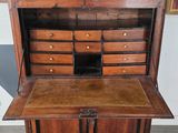 an old wooden desk with drawers and drawers on it