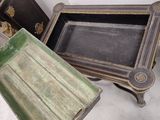 two wooden trays sitting next to each other on a table