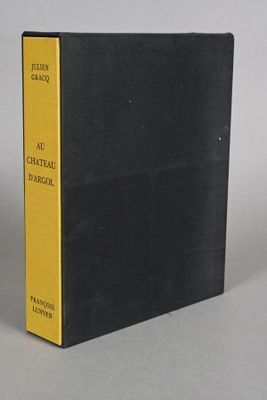 a black book with yellow pages sitting on top of a table