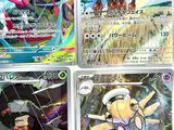 four different pokemon cards are displayed on a white surface