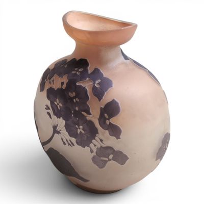 a vase with a flower design on it on a white surface