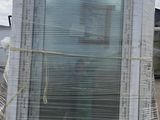 a large window sitting on a pallet in a parking lot
