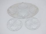 three clear glass dishes sitting next to each other on a white surface