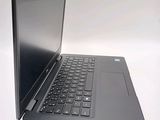 a laptop that is open on a white surface